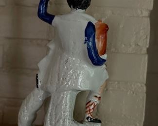 Antique Scottish Staffordshire Figurine with Dog. Measures 14” H x 7” W. Photo 2 of 3.