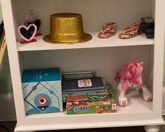 White bookshelf with headboard back.