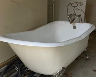 Clawfoot bathtub. Nickel feet. Measures 65" W x 30" D. Photo 1 of 4.