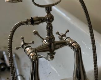 Clawfoot bathtub. Nickel feet. Measures 65" W x 30" D. Photo 2 of 4.