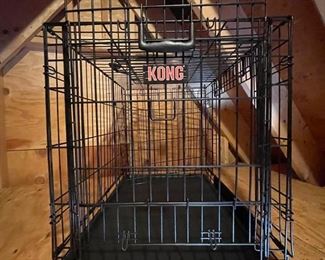 Medium-size collapsable metal dog crate.