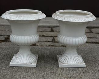 Pair of glazed white urns.