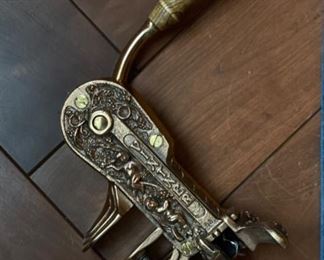 Rogar Estate brass wine bottle opener with wood handle.