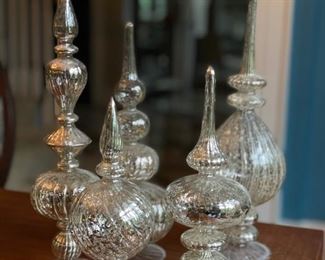 Collection of decorative Mercury glass pieces.