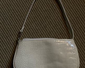 White faux leather handbag.
