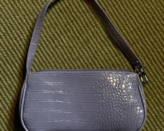 Purple faux leather handbag.