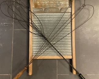 Antique National Washboard Company washboard and primitive wire wood handle rug beaters.