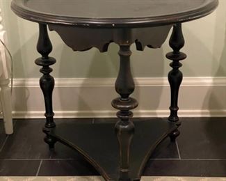 Carved wood side table. Measures 24" D x 20" H. Great as is, strip to original wood grain or paint for coastal chic look and feel. Photo 1 of 3.