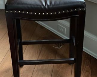 Set of three leather bar stools with nailhead trim. Each measures 18" x 12" x 25". Photo 1 of 3.