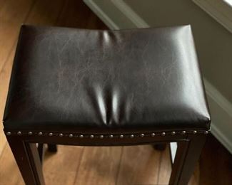 Set of three leather bar stools with nailhead trim. Each measures 18" x 12" x 25". Photo 2 of 3.