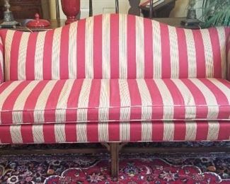 Handsome Americana camelback sofa.
Down cushion.