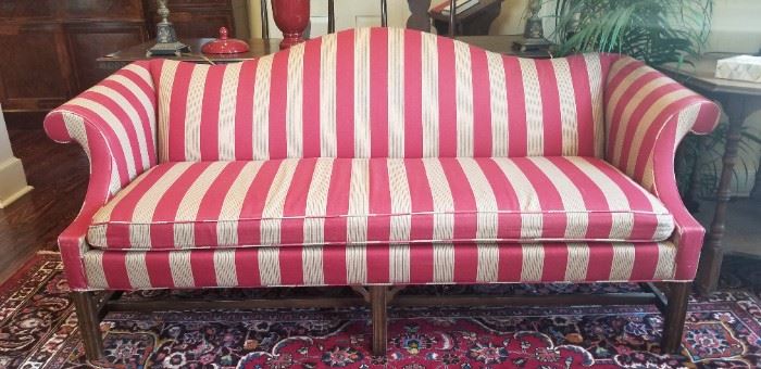 Handsome Americana camelback sofa.
Down cushion.