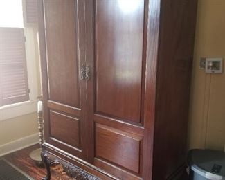 Handsome mahogany cabinet. It has lighting and 3 shelves. So many uses, you decide.