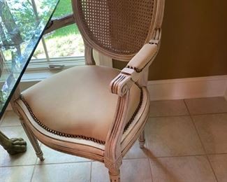 Unique "Roman Inspired", lion leg kitchen table with a thick square glass top and 4 studded cane back chairs