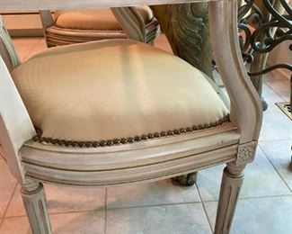 Unique "Roman Inspired", lion leg kitchen table with a thick square glass top and 4 studded cane back chairs