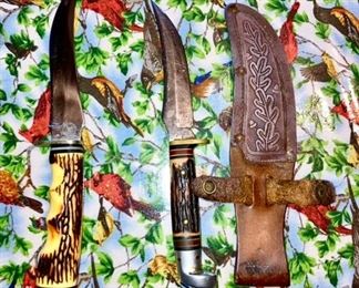 Antique hunting knives, one with sheath, knife on left is signed "Whitetail Cutlery"