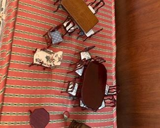 #261	doll house furniture Dining Table w/Chairs (2) & Round End Table w/chest of drawers - approx. 18 pcs	 $75.00 
