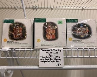 #293	Christmas In the Cuity - 3 pc. Ornaments - Dorothy's Dress Shop, Red Brick Fire Station, Hollydale's Dept Store	 $45.00 
