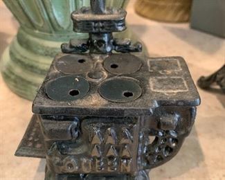 #301	Cast Iron Mini Stove w/4 removable eyes - 4" tall	 $30.00 
