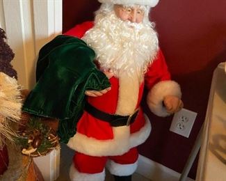 #323	christmas	tall santa with ceramic face and body 	 $50.00 	
