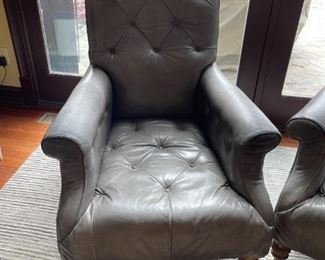 . . . one of three or four grey leather accent chair