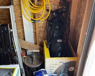 Black cat power washer. Gray Mills airlift agitating parts cleaner.