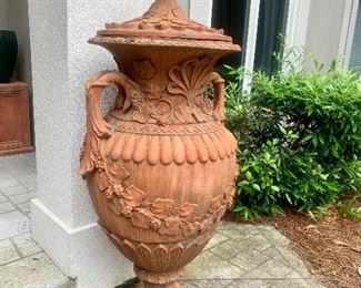pair of matching terra cotta covered urns, approx 5’ tall
