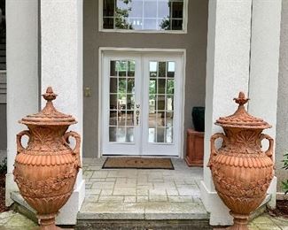 pair of matching terra cotta covered urns, approx 5’ tall by 23” & 27” wide