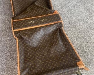 Authentic Louis Vuitton garment bag (unfortunately, damaged wheels)