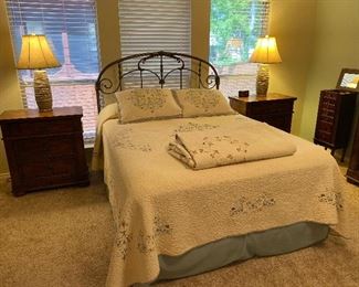 Queen ornate metal bed in the style of an old cast iron headboard. 