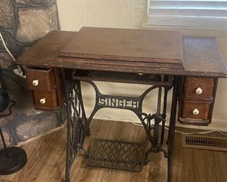 #3	Singer Treadle w/Foot Pedal In Cabinet	$95 
