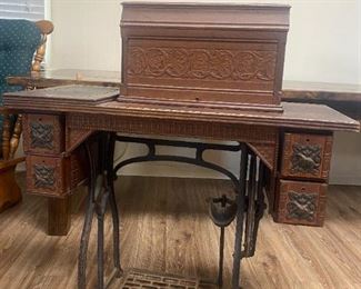 #8	Wheeler Wilson Mfg. Co. Machine in Tredle Cabinet 	 $100.00 
