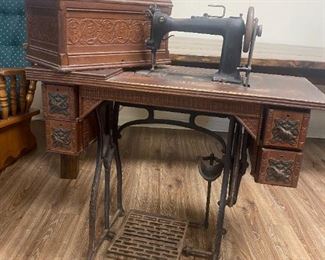 #8	Wheeler Wilson Mfg. Co. Machine in Tredle Cabinet 	 $100.00 
