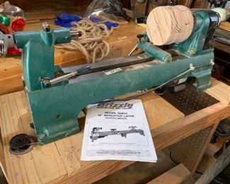 #64	Grizzly 10" Benchtop Lathe Model G0624 w/bench and tools 250	 $250.00 
