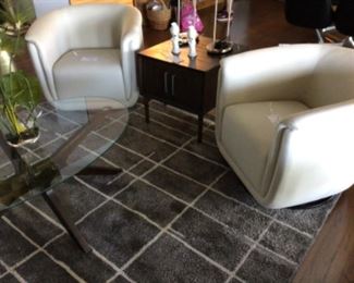 White Club Style Swivel Rockers, Gray/White 8 X 10 area rug and an oval coffee table