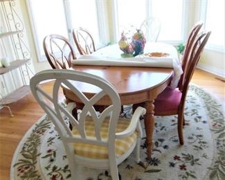 Solid wood dining table with matching chairs