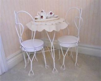 Child sized metal furniture, complete with tea serving set