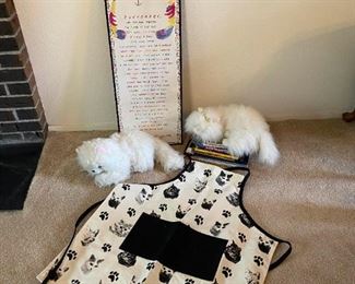 Cat Books apron wall art and two stuffed cat decor
