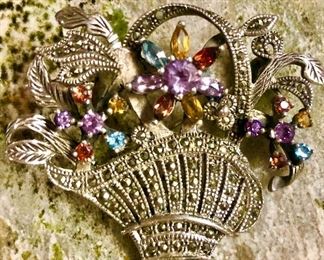 Sterling brooch with gemstones.
