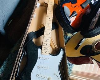 new in the box Fender Stratocaster electric guitar with amp
