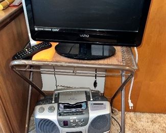 Small profile flatscreen TV on vintage rolling stand