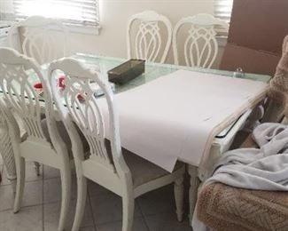 White dining table with glass top inset seats 6