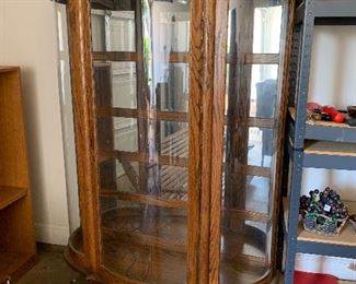 	#64	Lighted glass display cabinet with glass shelves and curved glass 42x13x63	 $125.00 	