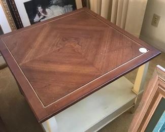 corner wood coffee table, cream base with shelf below, wood top