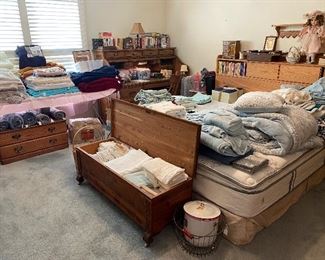 Master bedroom, king size headboard with storage mattress and box spring (very clean), vintage trunk with casters and brass trim, large rolltop desk with built-in light, many towels and linens. 