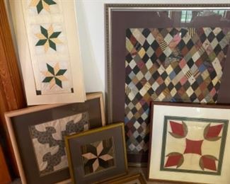 Framed antique quilt pieces 