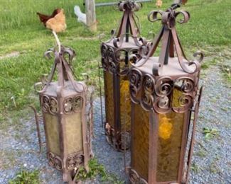Wrought iron antique lamps…The chickens will miss them