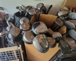 Men and woman golf clubs and bags