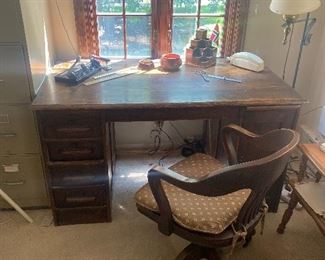 Desk and swivel office chair