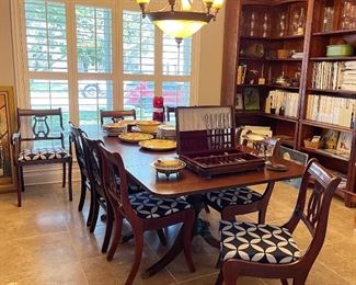Vintage dining room table and 8 chairs with updated fabric on seats